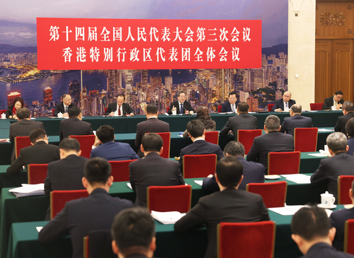3月7日上午，中共中央政治局常委、國務(wù)院副總理丁薛祥參加十四屆全國人大三次會(huì)議香港代表團(tuán)審議。新華社記者 劉衛(wèi)兵 攝